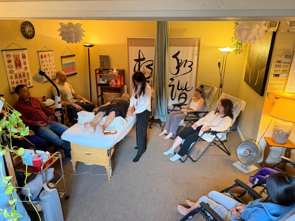 A group of people affected by Californian wildfires receive free community healing sessions from Wang at her clinic. Photo: Winnie Chan Wang